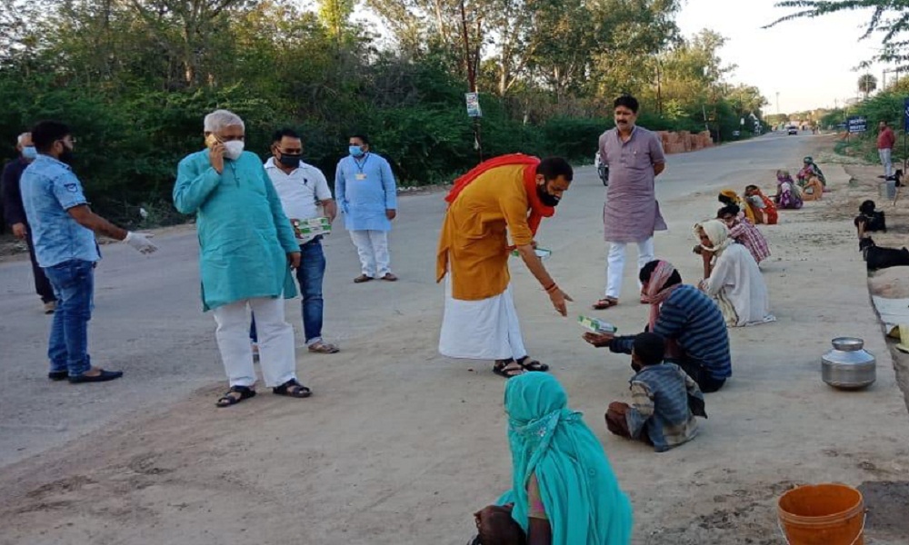 Sadar MLA from Banda Prakash Dwivedi distributed Modi lunch packet to poors