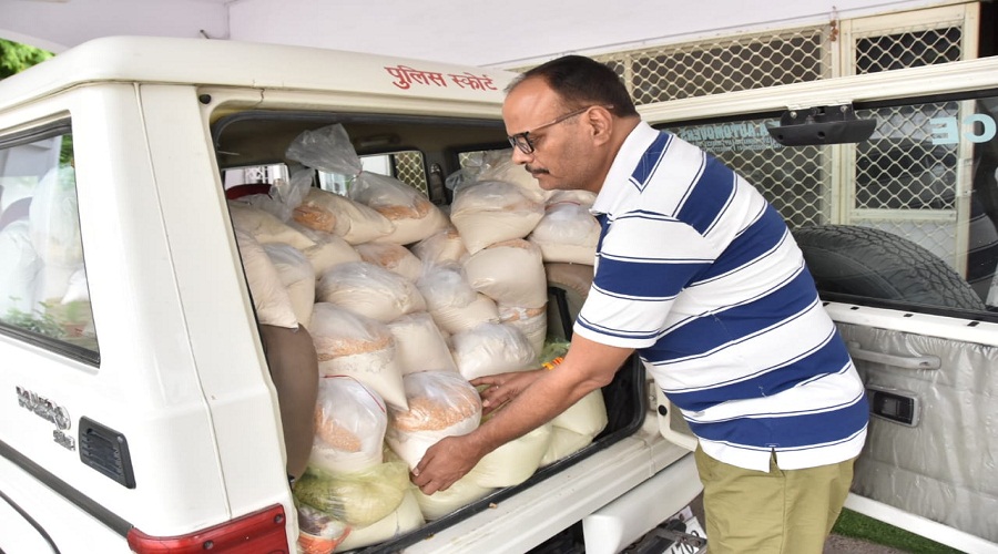 UP Law Minister Brajesh Pathak is distributing food grains and essential commodities to poor in lockdown