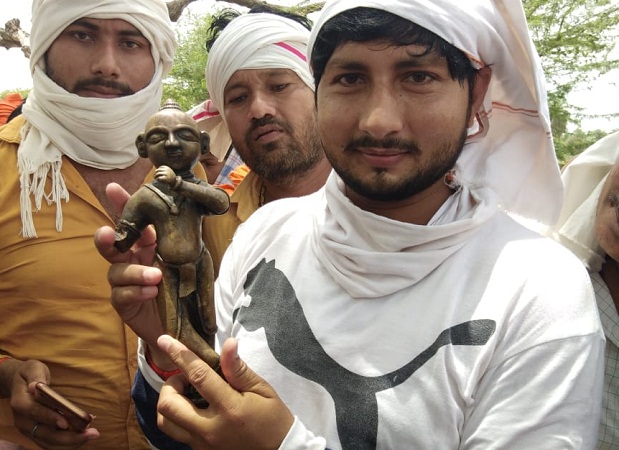 Precious Krishna statue recovered from well during excavation at Banda