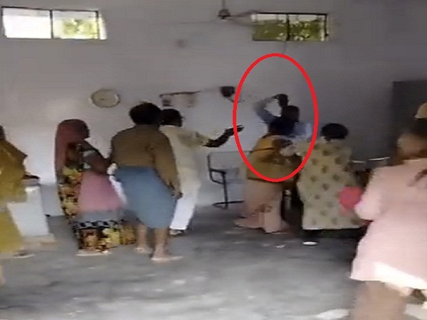 UP News : In school, headmaster beats female teacher with shoes, dispute over time of commuting, watch video